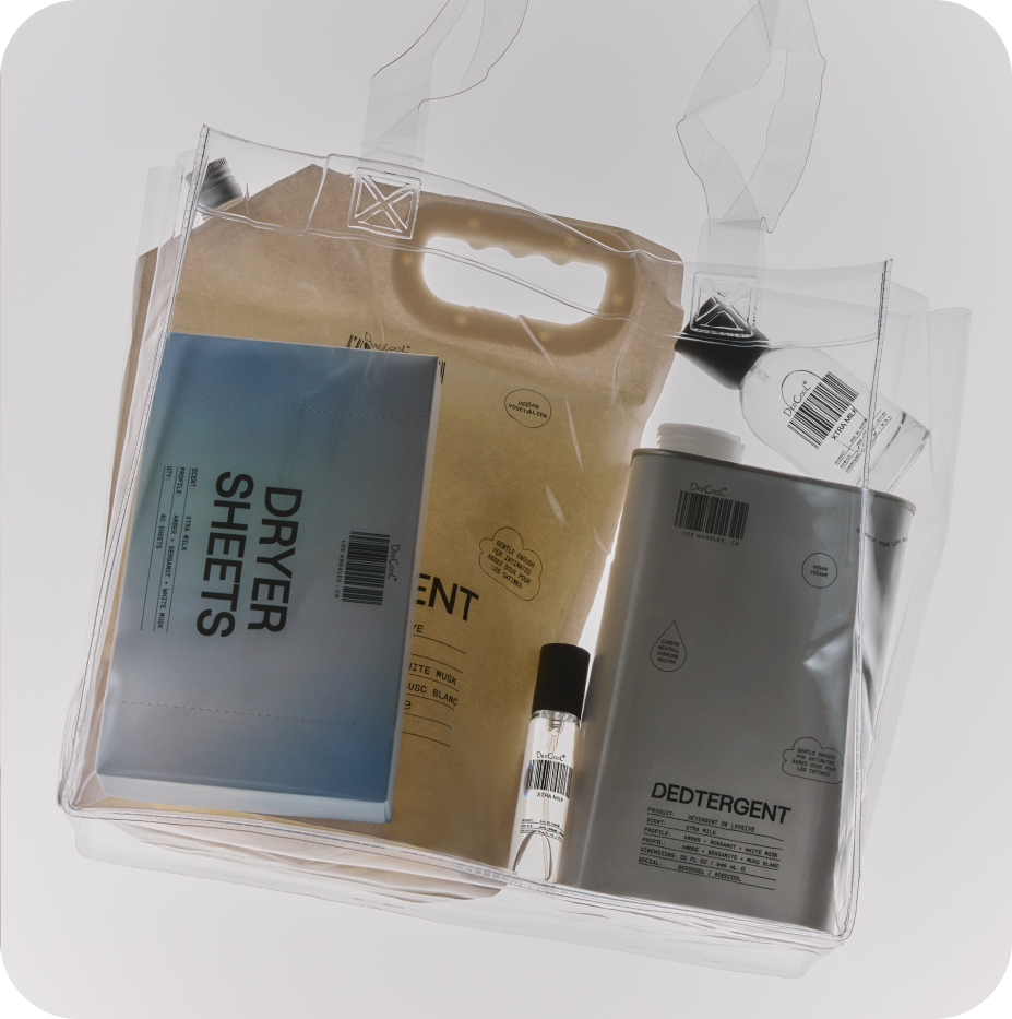 Packaging of dryer sheets, detergent, and a small Dedcool products bottles