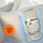 Beige laundry bag with blue trim andDED Cool branding, featuring a bottle of detergent.