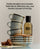 A perfume bottle labeled 'DedCool MOCHA MAGIC' stands next to a stack of stained ceramic mugs on a stack of plates with coffee spilling over with text at the top describing the scent.